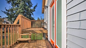 A wooden deck with a bench, a fenced area, and a house with green shutters. - Convenient Burien Getaway: 12 Mi to Dtwn SEA! (Burien)