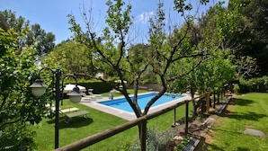 A backyard with a swimming pool, a wooden fence, and a garden area. - Antinoro 1, Montelupo Fiorentino, Italy (Montelupo Fiorentino)
