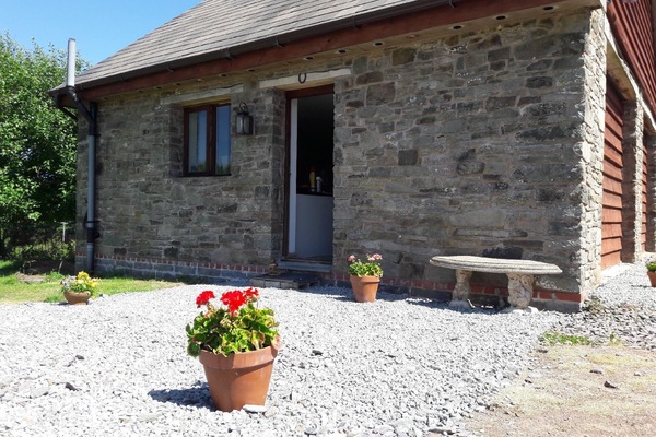 External view of the building. The Barn Annexe on a sunny day
