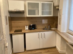 Fridge, microwave, stovetop, coffee/tea maker