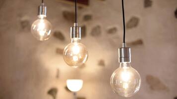Three hanging light bulbs with visible filaments.