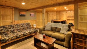 TV, fireplace, books - Lakehouse Condo 3B | Shared Beach Access on Rangeley Lake (Rangeley)