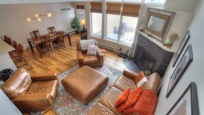 TV, fireplace, books - Lakehouse Condo 3B | Shared Beach Access on Rangeley Lake (Rangeley)