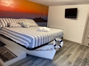 1 chambre, coffre-fort, fer et planche à repasser