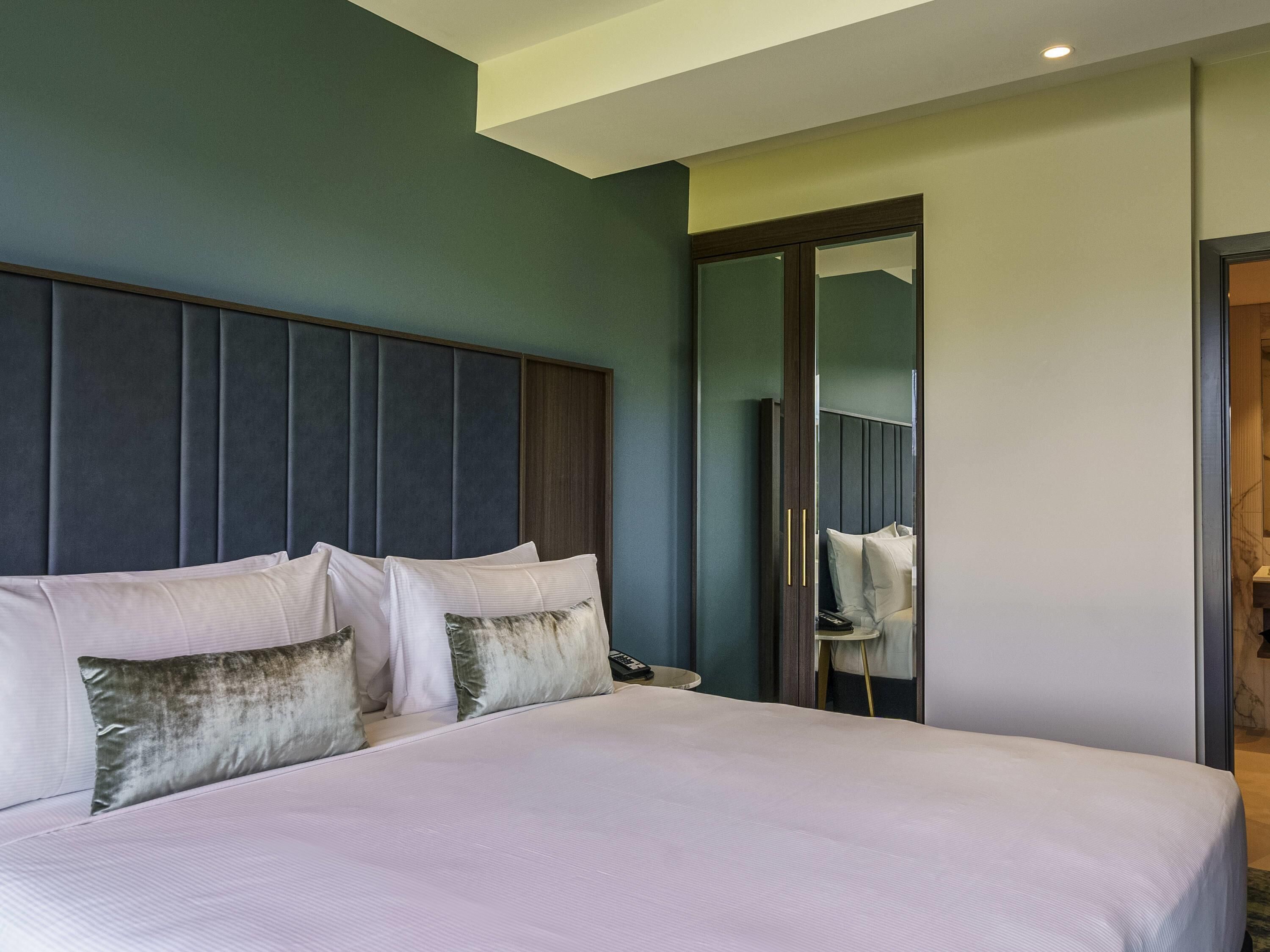 Deluxe-sviitti, näköala puutarhaan | Kannettavalle tietokoneelle sopiva työtila, äänieristys