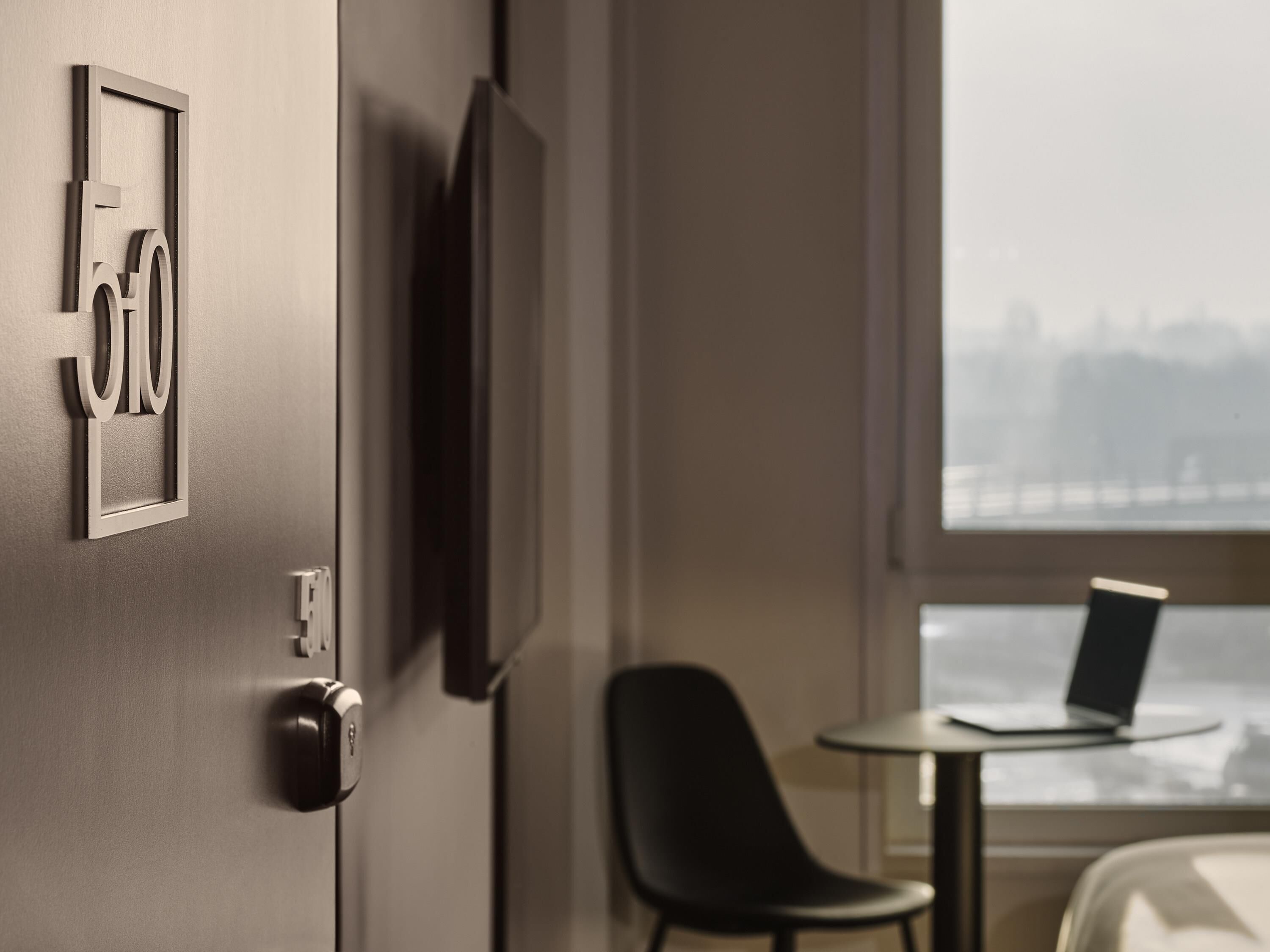 premium bedding, pillow-top beds, desk, laptop workspace