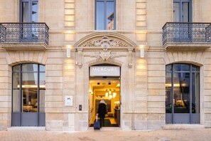 The entrance to the Mercure Hotel with a grand facade, large windows, and a welcoming interior. - Mercure Bordeaux Centre Gare Atlantic (Bordeaux)