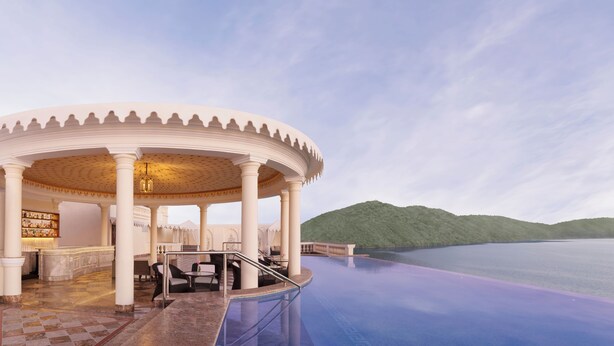 A luxurious outdoor pool area with a gazebo, bar, and seating. - Raffles Udaipur (Udaipur)