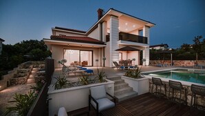 A modern two-story house with a swimming pool, outdoor seating, and a stone staircase. - Gorgeous Villa Luana with wellness and pool (Malinska)