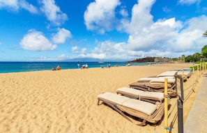 Relax on the beach with sun loungers and enjoy the marina views.