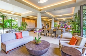 Relax in our inviting lobby with comfortable seating, a coffee table, and dining area.