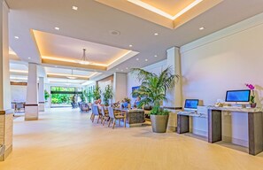 Relax in our spacious lobby with comfortable seating and lush greenery.