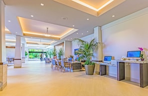 Relax in our spacious lobby with comfortable seating and lush greenery.