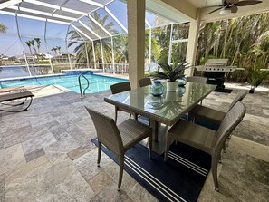 Outdoor dining - Contemporary waterfront pool home with Gulf access (CAPE CORAL)