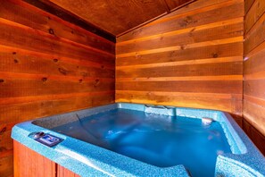 A hot tub with a digital control panel, surrounded by wooden walls. - Amazing Mountain View Cabin with Jacuzzis, Hot Tub & StarlinkWIFI! Pets Welcome! (Sevierville)