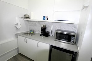 Microwave, stovetop, coffee/tea maker, electric kettle