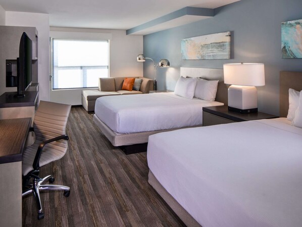 A hotel room with two beds, a desk, a chair, a TV, and a window. - Hyatt House Lewes/Rehoboth Beach (Lewes)