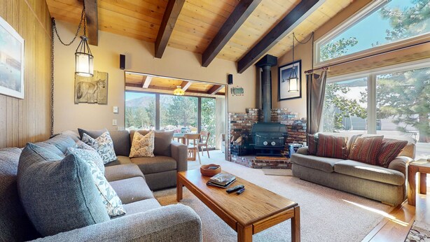 A cozy living room with two sofas, a coffee table, and a fireplace. - Chateau Blanc 25 Cozy with Gorgeous Mountain Views, On the Shuttle Route, by RedAwning (Mammoth Lakes)
