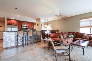 TV, fireplace, table football - Silver Bear 22 Pet-Friendly, Cozy, Underground Parking, Walk to Canyon Lodge by RedAwning (Mammoth Lakes)