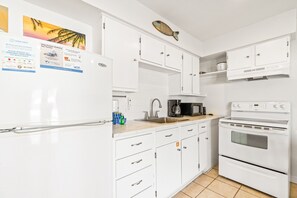 Enjoy cooking in this fully equipped kitchen with a stainless steel sink and coffee maker.