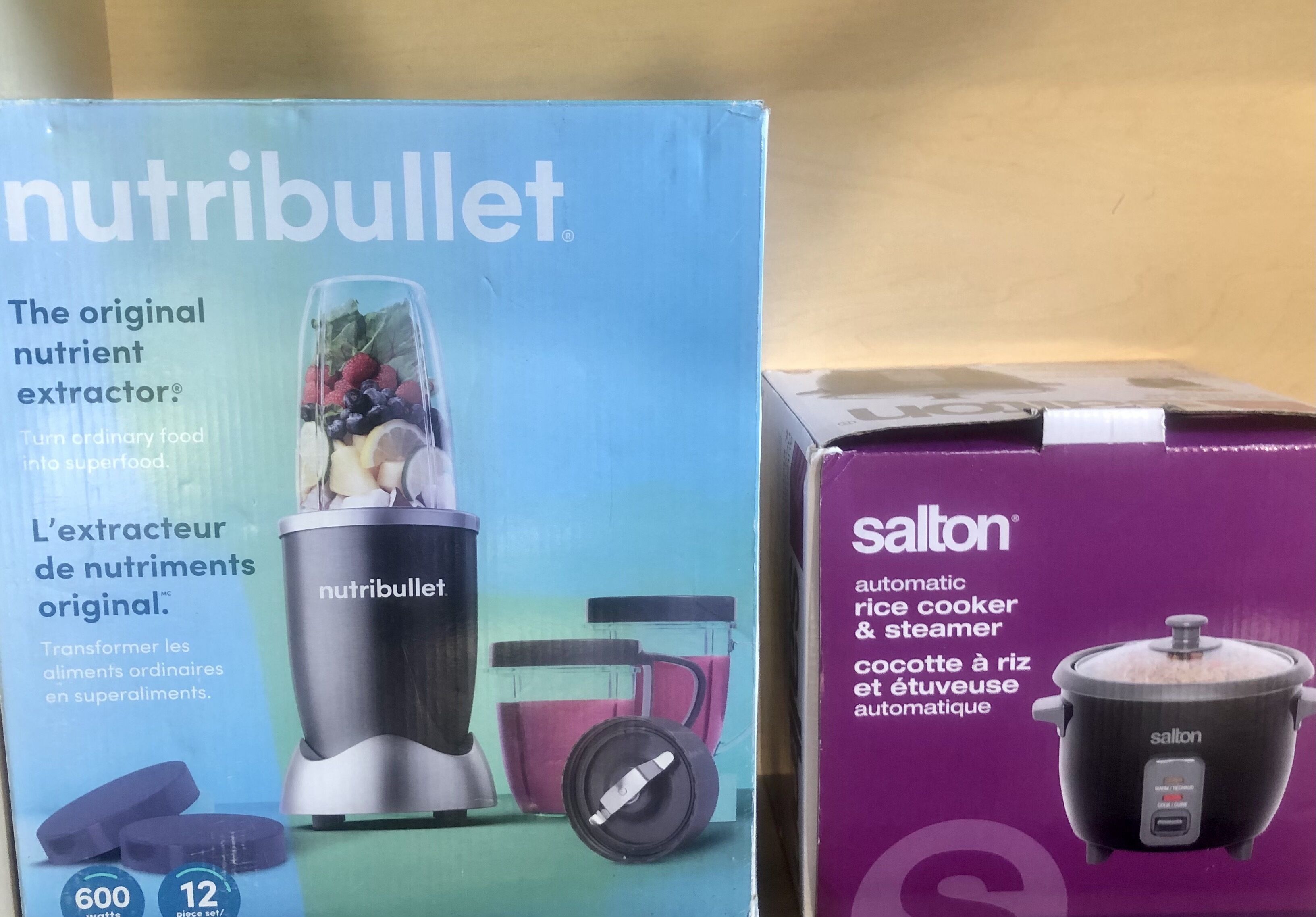 Two kitchen appliances: a Nutribullet blender and a Salton rice cooker.