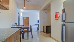Deluxe Double Room, Balcony | Private kitchen | Coffee/tea maker, mini-fridge, electric kettle - Treebo Aquamarine Arpora With Pool (Arpora)