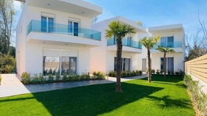 A modern two-story house with a flat roof, large windows, and a balcony. - Villas Acrotel Porto Brava, Ormos Panagias (Ormos Panagias)