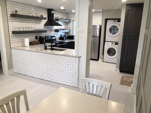 Kitchen front view, Washer and dryer. Pantry to the right. - A little Piece of Paradise - newly renovated condo (Wesley Chapel)
