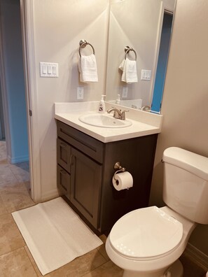 Bathtub, hair dryer, towels, soap