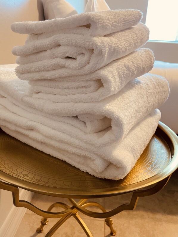 Bathtub, hair dryer, towels, soap
