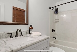 Combined shower/bathtub, hair dryer, towels, soap