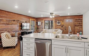 Enjoy cooking in this kitchen with a large island, dishwasher, and cozy seating area.