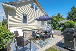 Enjoy al fresco dining on the patio with a barbecue grill and comfortable seating.