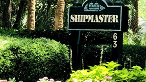 A sign with the name 'SHIPMASTER' and the number '63' in a lush garden setting. - HUGE 4 BR/3 BATH Villa 15 minute walk to Beach (3 min walk to the pool) (Hilton Head Island)