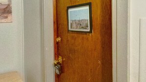 A wooden door with a number '5' and a small framed picture. - Parkview, Apt #5
Parkview Historic Apartment (Hershey)