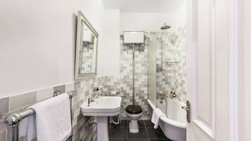 Bathtub, hair dryer, shampoo