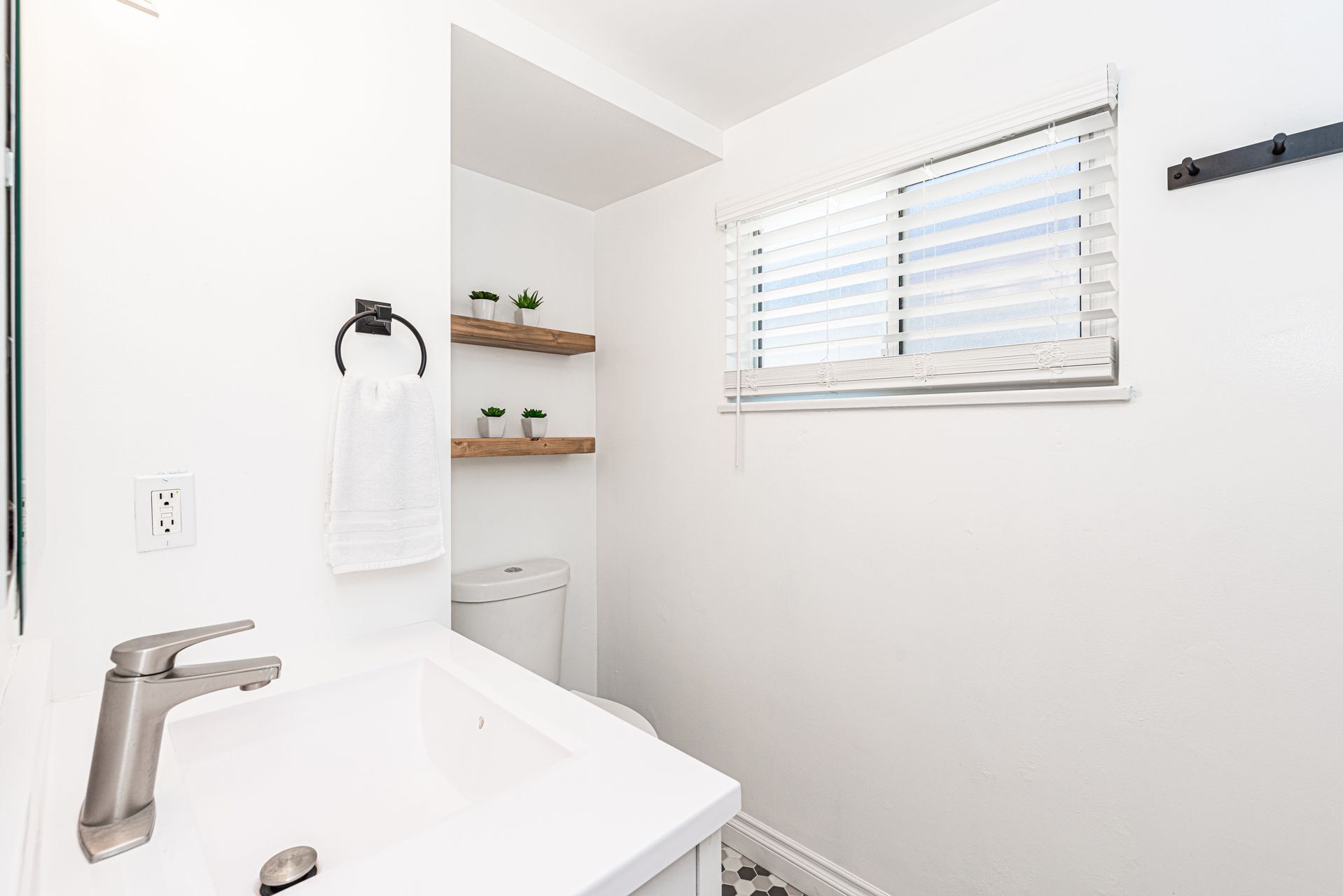 Bathroom is located off of the hallway. It includes a tub/shower combination.
                
