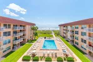 A heated pool - Luxury Oceanview Penthouse W/ Balcony- Cocoa Beach 🌊 (Cocoa Beach)