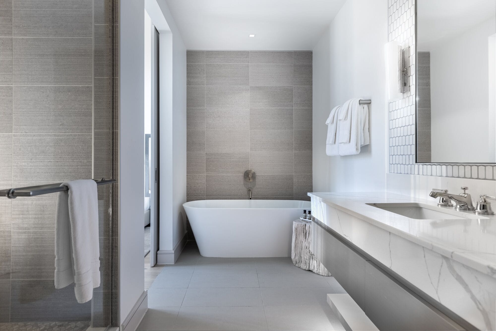 deep-soaking bathtub, rainfall showerhead, designer toiletries