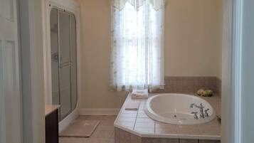 Bathtub, hair dryer, towels, soap