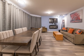Luxury Apartment | Living area | 55-inch Smart TV with cable channels, TV, fireplace