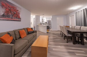 Luxury Apartment | Living area | 55-inch Smart TV with cable channels, TV, fireplace