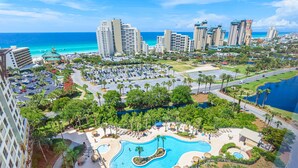 A resort with a large pool area, multiple buildings, and a view of the ocean. - Gulf Views ~ Lockout Unit ~ Private Foyer ~ Balcony (Miramar Beach)