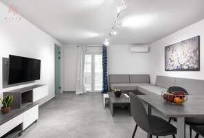 Departamento Deluxe | Sala de estar | Televisión 