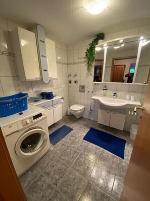 Combined shower/tub, hair dryer, towels, soap