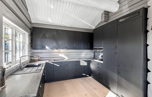 Fridge, microwave, coffee/tea maker, cookware/dishes/utensils