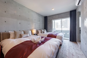 Premium bedding, laptop workspace, blackout curtains, free WiFi