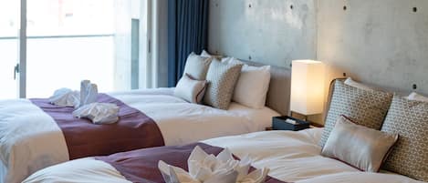 Premium bedding, laptop workspace, blackout curtains, free WiFi