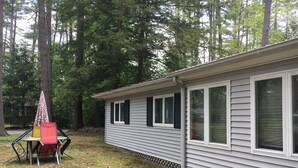 A single-story mobile home with a covered patio area.