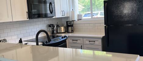 Coffee/tea maker, fridge, microwave, oven